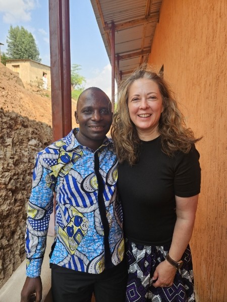 Jean (our Burundian translator and teacher trainer) and I, outside the school at Muyaga.
